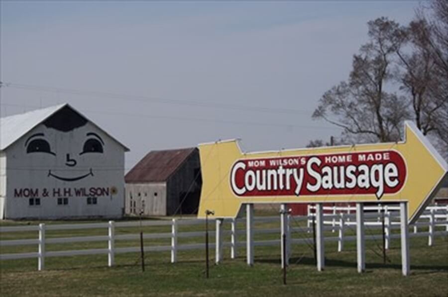 Big arrow sign on route 23 pointing to Ma Wilson's Home Made Country Sausage market in Delaware, Ohio