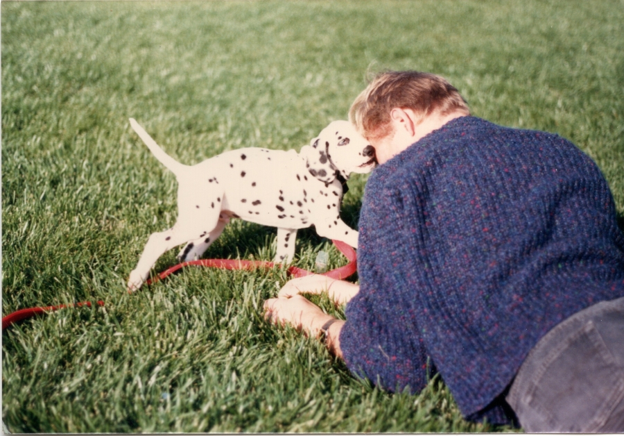 Shanti as a puppy playing with me in the yard