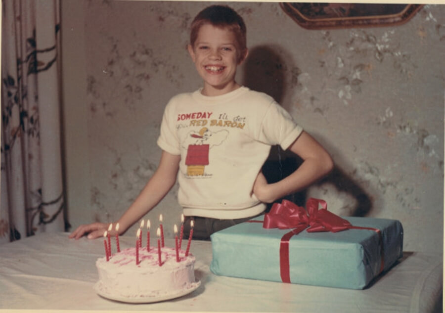 Daryl (Schuyler) Hoffman's 11th birthday with cake, candles, and a gift