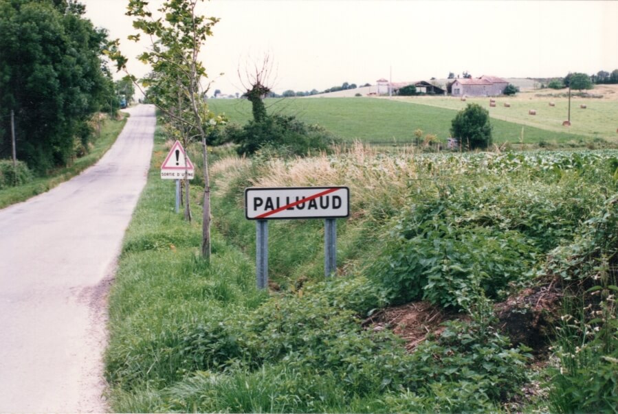 The leaving Pallaud road sign: Pallaud with a red slash through the name