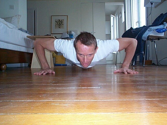 Schuyler Hoffman doing his morning workout in his apartment in Paris